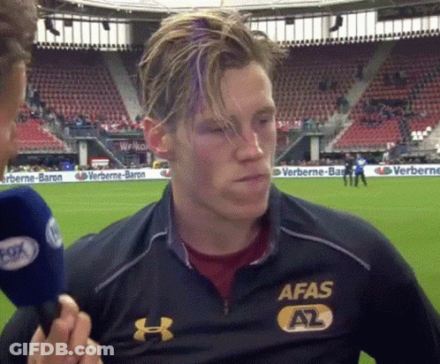A Man Wearing An Afas Shirt Is Being Interviewed By A Reporter GIF