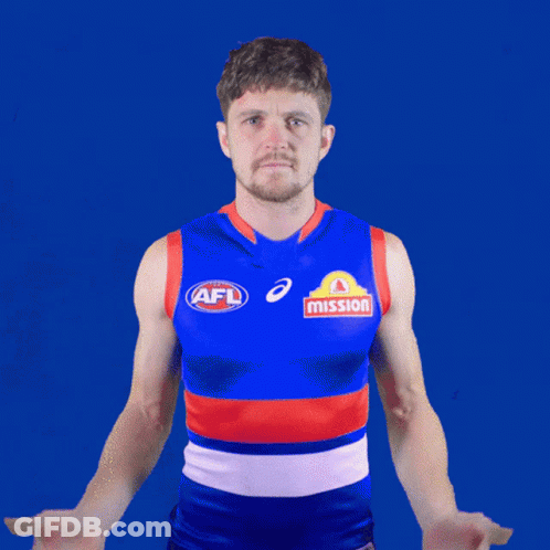 A Man Wearing An Afl Jersey With Mission Written On The Front GIF
