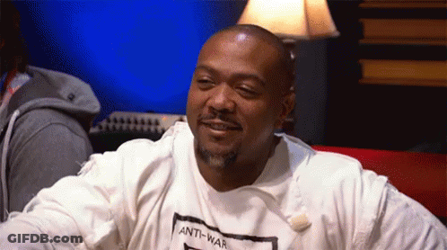 A Man Wearing An Anti-War T-Shirt Is Smiling GIF