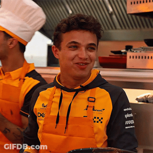 A Man Wearing An Apron And A Hoodie That Says ' Ferrari ' On It GIF