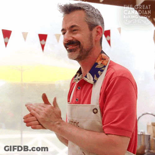 Man In Red Shirt Clapping In Front Of Baking Show GIF