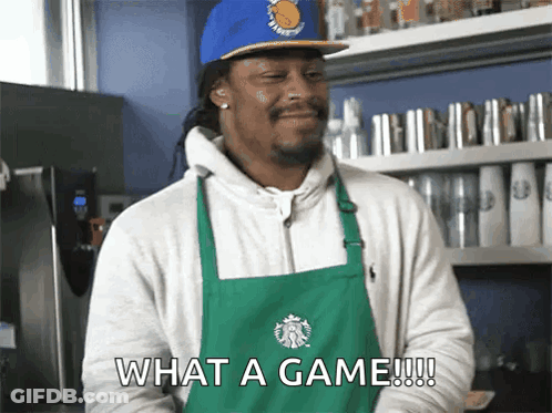 A Man Wearing An Apron And A Starbucks Hat Says " What A Game " GIF