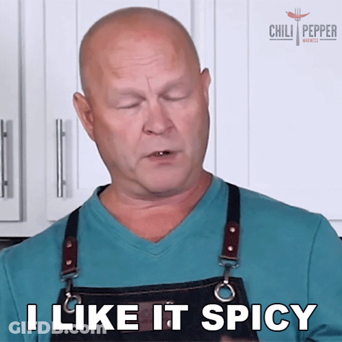 A Man Wearing An Apron Is Saying I Like It Spicy GIF