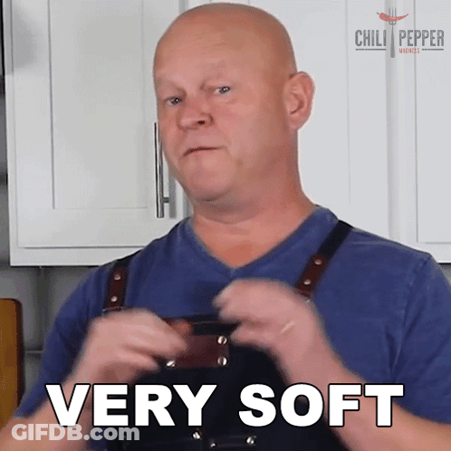 A Man Wearing An Apron Says Very Soft GIF