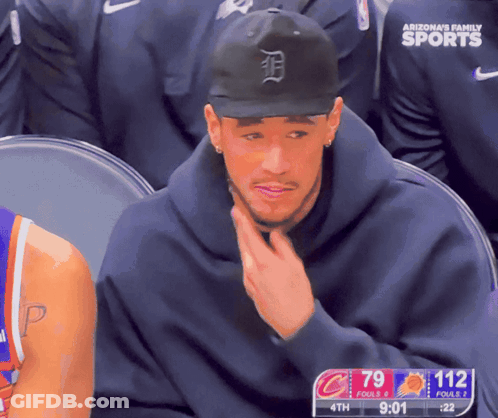 A Man Wearing An Arizona 'S Family Sports Hat Sits In A Stadium GIF