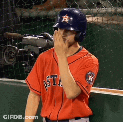 A Man Wearing An Astros Jersey Covers His Face With His Hand GIF