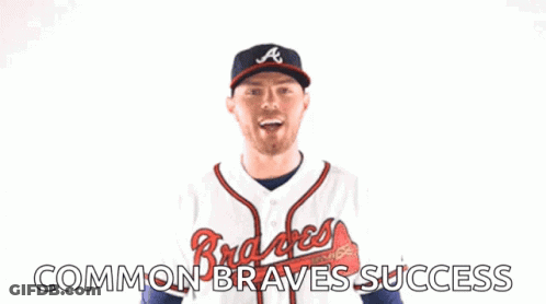 A Man Wearing An Atlanta Braves Jersey Is Celebrating GIF