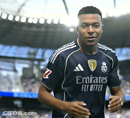 A Man Wearing An Emirates Fly Bitter Jersey Is Running GIF