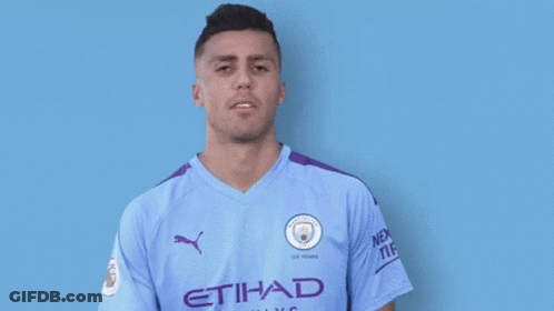A Man Wearing An Etihad Airways Jersey Smiles For The Camera GIF