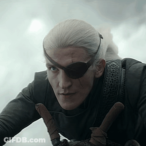 A Man Wearing An Eye Patch And Holding A Sword . GIF