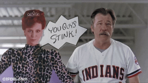 A Man Wearing An Indians Jersey Stands Next To A Woman GIF
