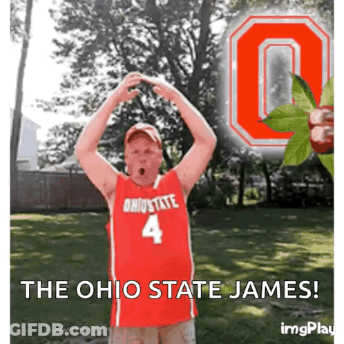 A Man Wearing An Ohio State Jersey Is Making A Heart Shape With His Hands GIF