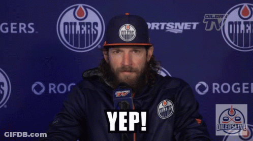 A Man Wearing An Oilers Hat Says Yep In Front Of A Blue Wall GIF