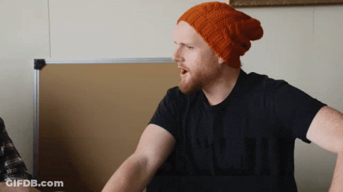 Man With Orange Beanie And Black Shirt Talking GIF
