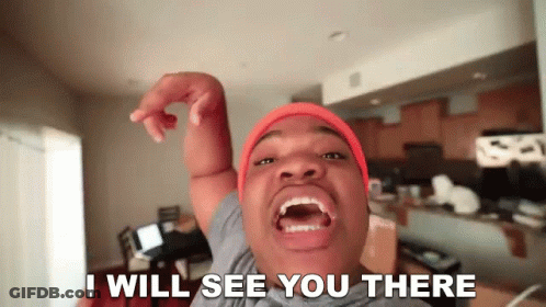 A Man Wearing An Orange Beanie Says I Will See You There GIF