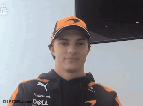 A Man Wearing An Orange Hat And A Black Hoodie With Dell On The Front GIF