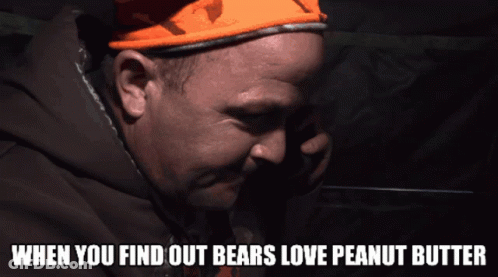 A Man Wearing An Orange Hat With The Words When You Find Out Bears Love Peanut Butter GIF