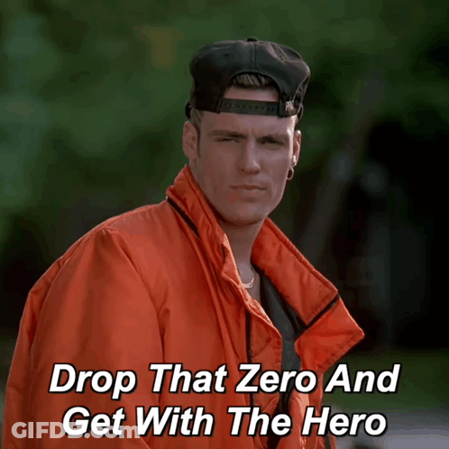 A Man Wearing An Orange Jacket And A Black Hat With The Words Drop That Zero And Get With The Hero Below Him GIF
