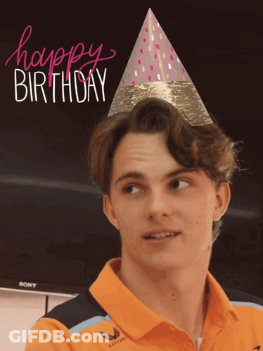 A Man Wearing An Orange Shirt And A Party Hat With The Words Happy Birthday On It GIF