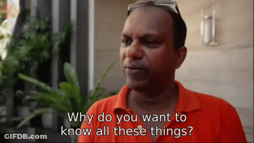A Man Wearing An Orange Shirt Is Asking Why Do You Want To Know All These Things GIF