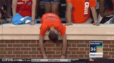 A Man Wearing An Orange Shirt That Says Crew On It GIF