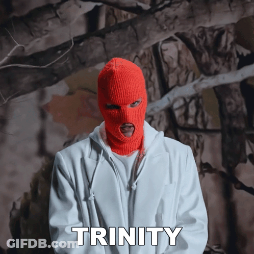 A Man Wearing An Orange Ski Mask And A White Jacket Says Trinity In White Letters GIF