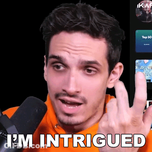A Man Wearing An Orange Sweatshirt Says I 'M Intrigued GIF