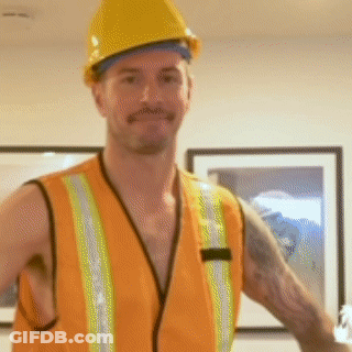 A Man Wearing An Orange Vest And Hard Hat GIF
