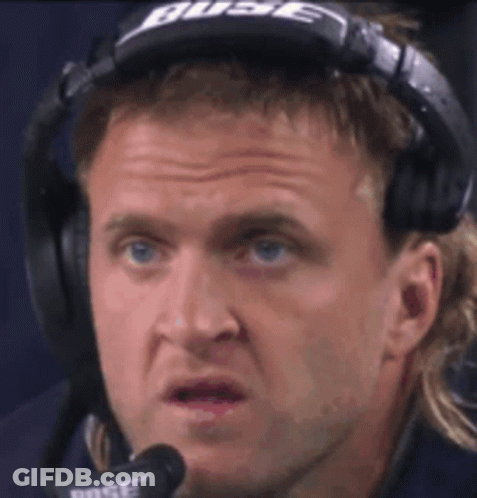 A Man Wearing Bose Headphones Is Making A Funny Face . GIF