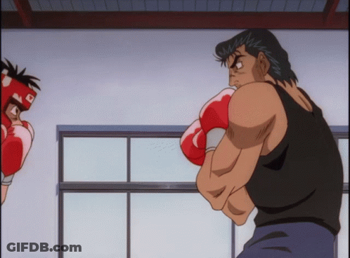 A Man Wearing Boxing Gloves And A Helmet With The Letter R On It GIF
