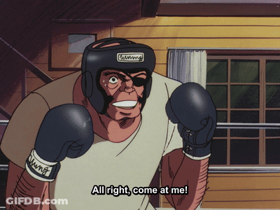 A Man Wearing Boxing Gloves And A Helmet With The Words All Right Come At Me GIF