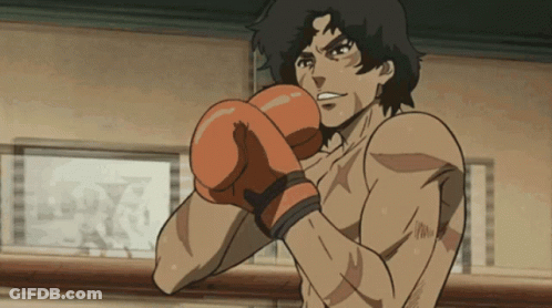 A Man Wearing Boxing Gloves Is Standing In Front Of A Wall With A Picture On It That Says Ldx GIF