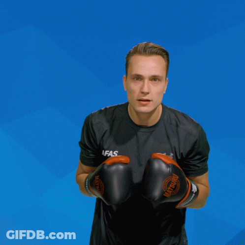 A Man Wearing Boxing Gloves That Say Afas GIF