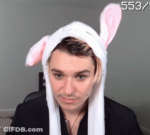 A Man Wearing Bunny Ears Has The Number 553 On The Bottom GIF