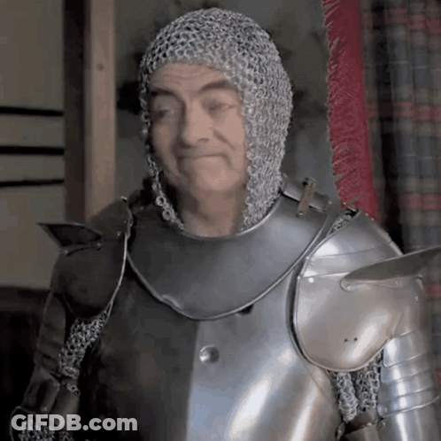A Man Wearing Chain Mail And Armor Is Smiling GIF