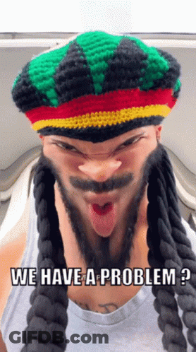 A Man Wearing Dreadlocks And A Rasta Hat Says We Have A Problem GIF
