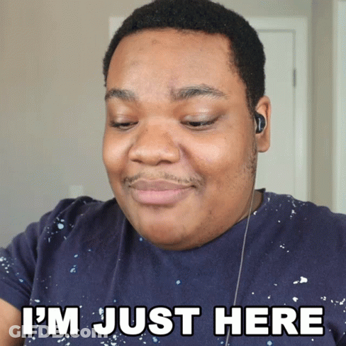 A Man Wearing Ear Buds And A Blue Shirt Says I 'M Just Here GIF