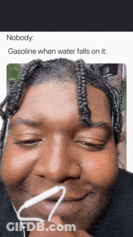 A Man Wearing Ear Buds Is Smiling With A Caption That Says Nobody Gasoline When Water Falls On It GIF