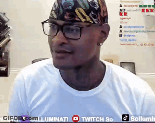 A Man Wearing Glasses And A Bandana Is Sitting In Front Of A Twitch So Banner GIF