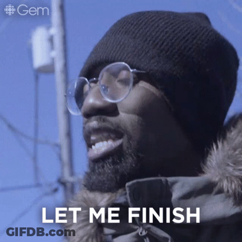 A Man Wearing Glasses And A Beanie Is Smiling And Says Let Me Finish GIF