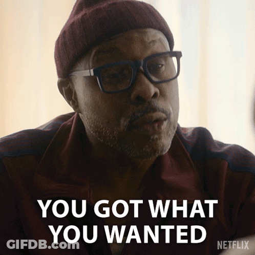 A Man Wearing Glasses And A Beanie Says You Got What You Wanted GIF