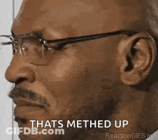 A Man Wearing Glasses And A Beard Is Making A Funny Face And Says `` Thats Methed Up '' . GIF
