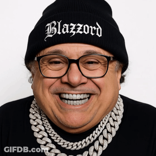 A Man Wearing Glasses And A Black Beanie That Says Blazzard GIF