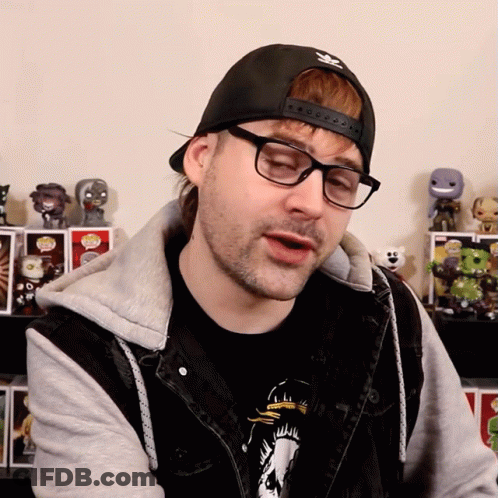 A Man Wearing Glasses And A Black Hat With The Adidas Logo On It GIF