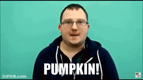 A Man Wearing Glasses And A Black Hoodie Is Talking About Pumpkin . GIF