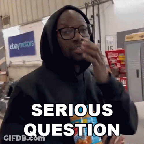 A Man Wearing Glasses And A Black Hoodie Says Serious Question While Holding A Bag Of Chips . GIF