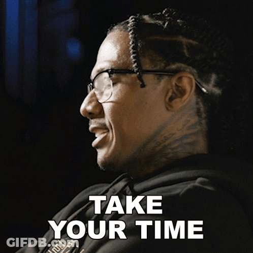 A Man Wearing Glasses And A Black Hoodie Says Take Your Time GIF