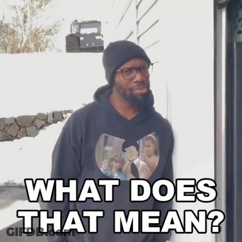 A Man Wearing Glasses And A Black Hoodie Says What Does That Mean GIF