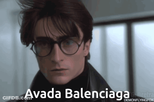 A Man Wearing Glasses And A Black Jacket Has The Name Avada Balenciaga On His Face GIF