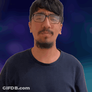 A Man Wearing Glasses And A Black Shirt Is Making A Funny Face GIF